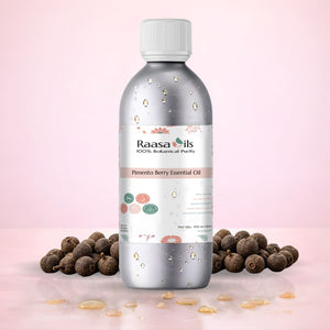 Bottle of Raasa Oils Pimento Berry Essential Oil with pimento berries on a light pink background