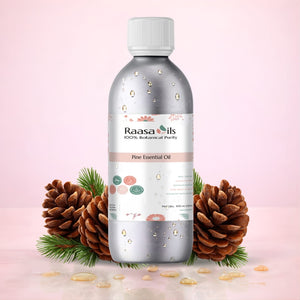 Bottle of Raasa Oils Pine Essential Oil with pine cones and leaves on a pink background