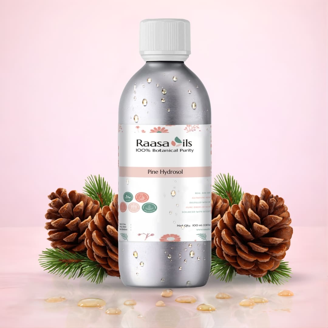 Bottle of Raasa Oils Pine Hydrosol with pine cones and leaves on a pink background