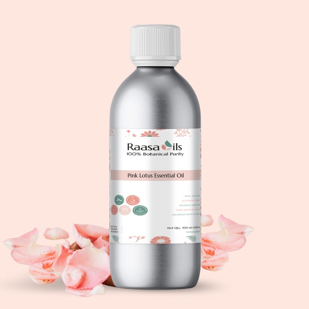 Raasa Oils Pink Lotus Essential Oil bottle with pink lotus flowers on a light pink background