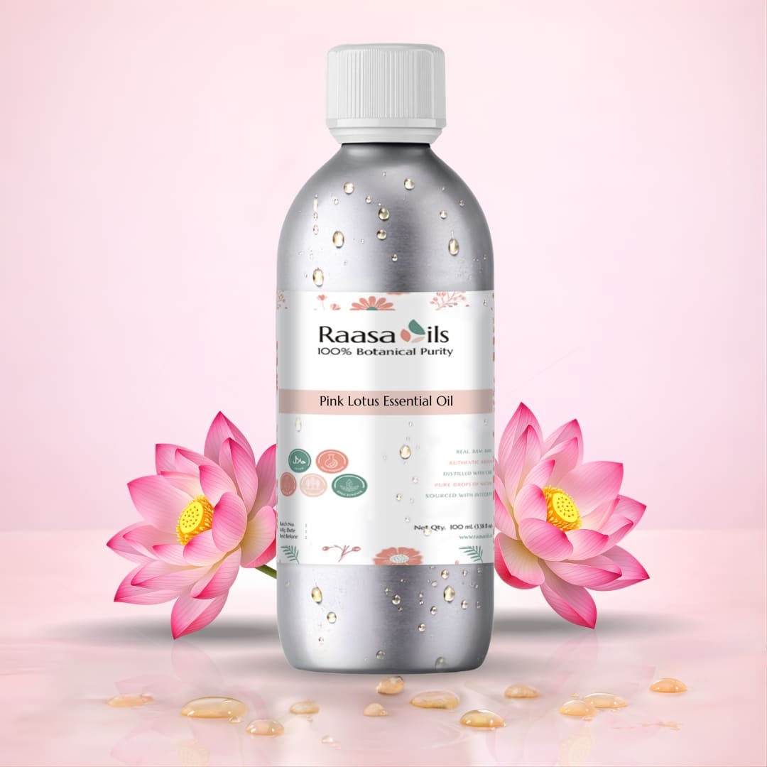 Raasa Oils Pink Lotus Essential Oil bottle with pink lotus flowers on a light pink background