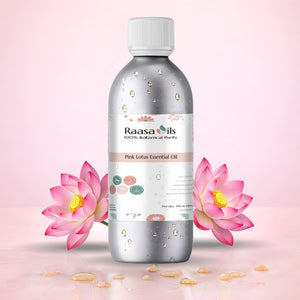 Raasa Oils Pink Lotus Essential Oil bottle with pink lotus flowers on a light pink background