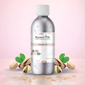 Bottle of Raasa Oils Pistachio Oil with pistachios on a pink background