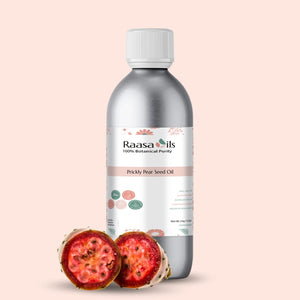 Raasa Oils Prickly Pear Seed Oil bottle with two halves of a prickly pear fruit on a beige background