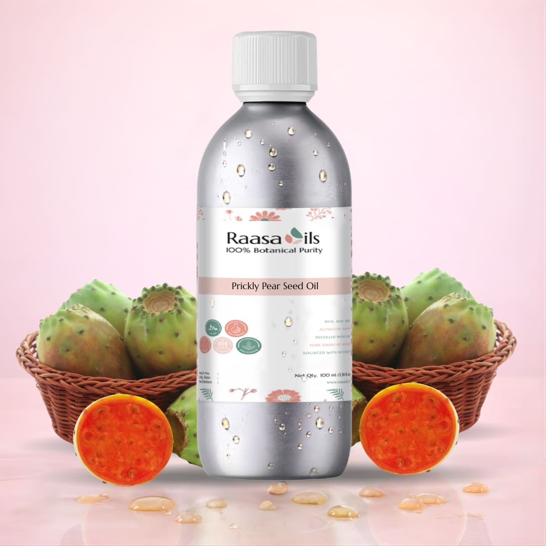 Bottle of Raasa Oils Prickly Pear Seed Oil with cacti and pads on a pink background
