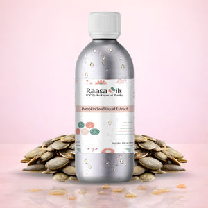 Bottle of Raasa Oils Pumpkin Seed Liquid Extract with pumpkin seeds on a pink background