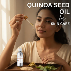 Woman applying quinoa seed oil to her face with a dropper, surrounded by quinoa seeds and leaves on a wooden tray.