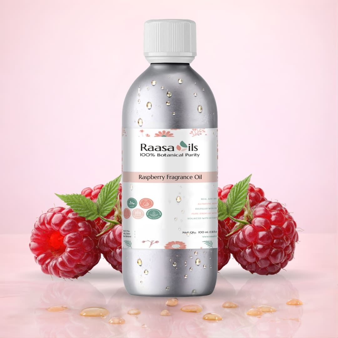 Bottle of Raasa Oils Raspberry Fragrance Oil with raspberries on a pink background