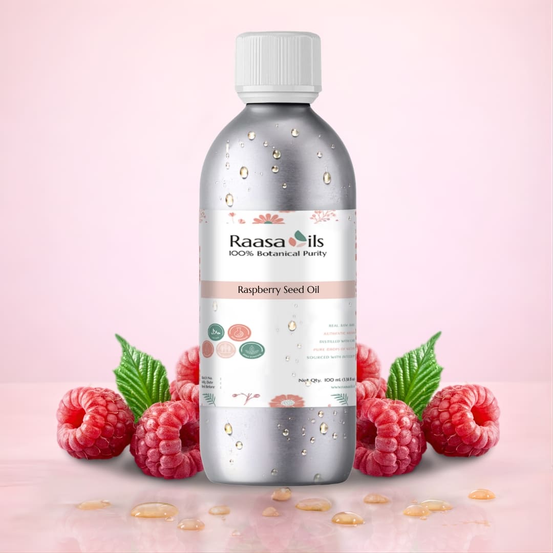 Bottle of Raasa Oils Raspberry Seed Oil with raspberries on a pink background