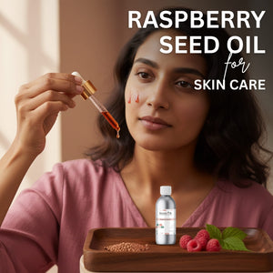 Woman holding a dropper with raspberry seed oil over her face, with a bottle and raspberries on a tray.