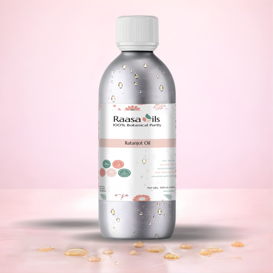 Bottle of Raasa Oils Ratanjot Oil on a pink background