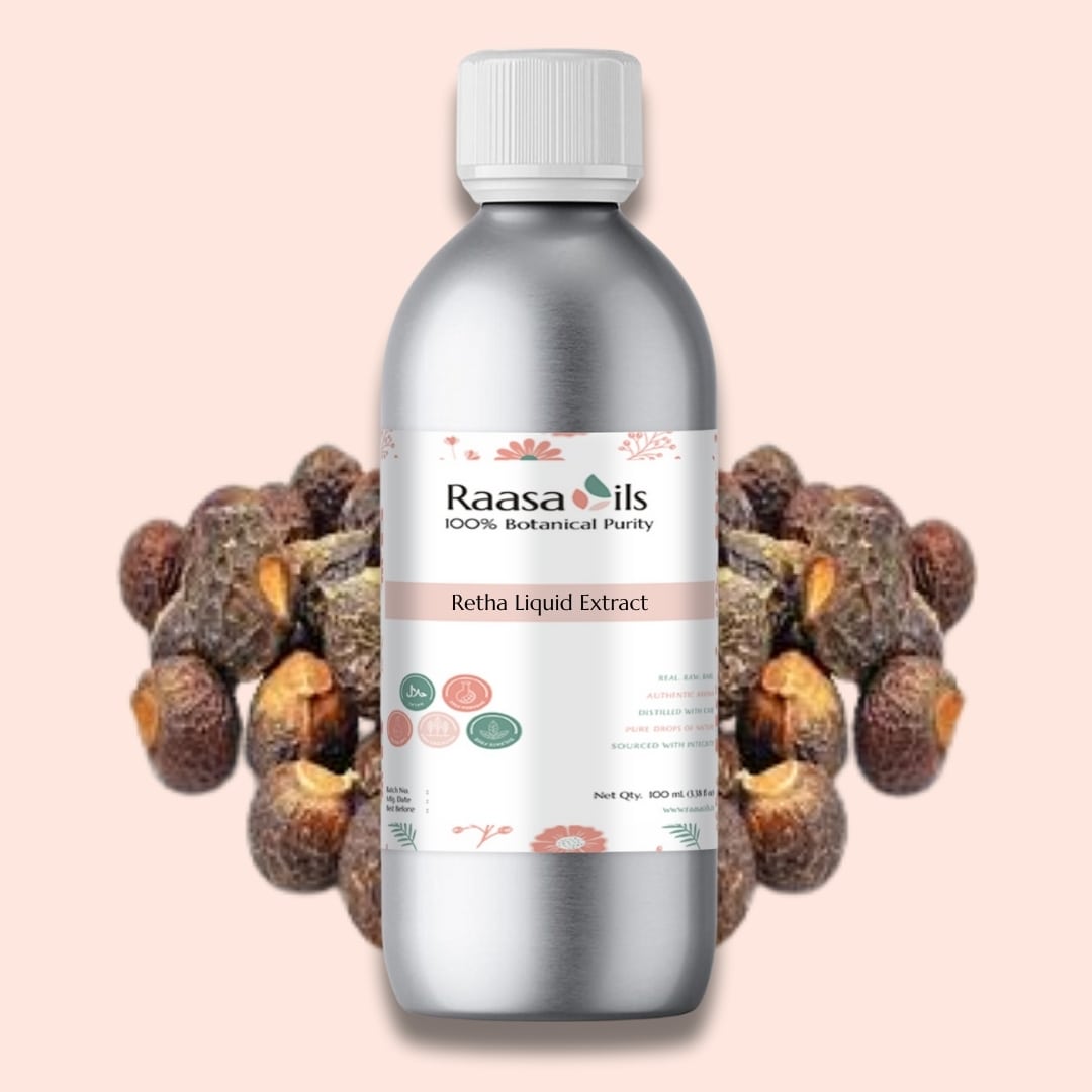 Bottle of Raasa Oils Retha Liquid Extract with dried Retha fruits on a light pink background