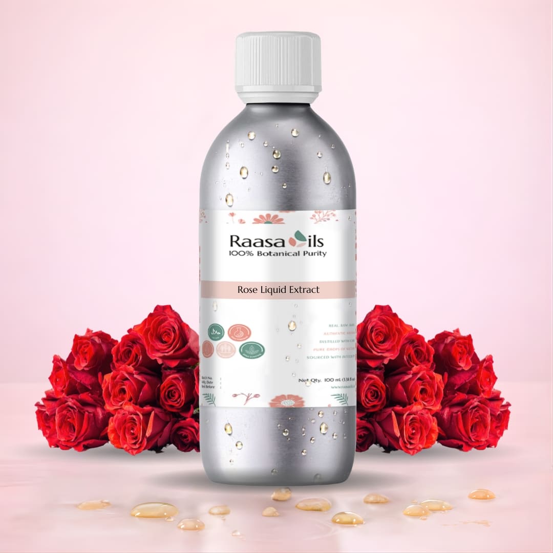 Raasa Oils bottle of Rose Liquid Extract with red roses on a pink background