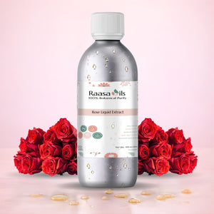 Raasa Oils bottle of Rose Liquid Extract with red roses on a pink background