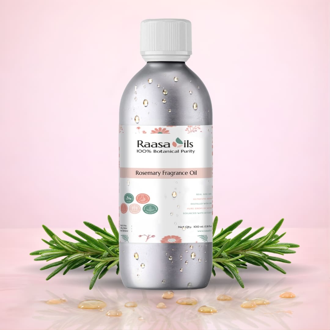 Bottle of Raasa Oils Rosemary Fragrance Oil with rosemary leaves on a pink background