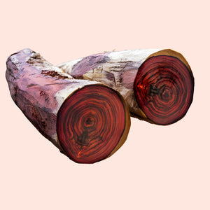 Two redwood logs with a pink background