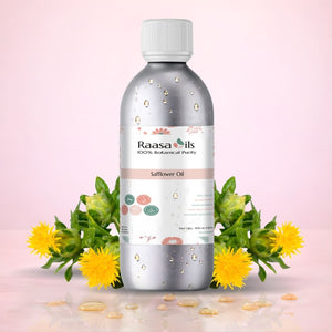 Bottle of Raasa Oils safflower oil with safflower flowers on a pink background
