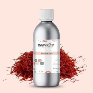 Bottle of Raasa Oils Saffron Hydrosol with saffron strands on a light pink background