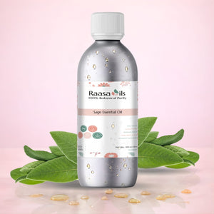 Bottle of Raasa Oils Sage Essential Oil with green leaves on a pink background