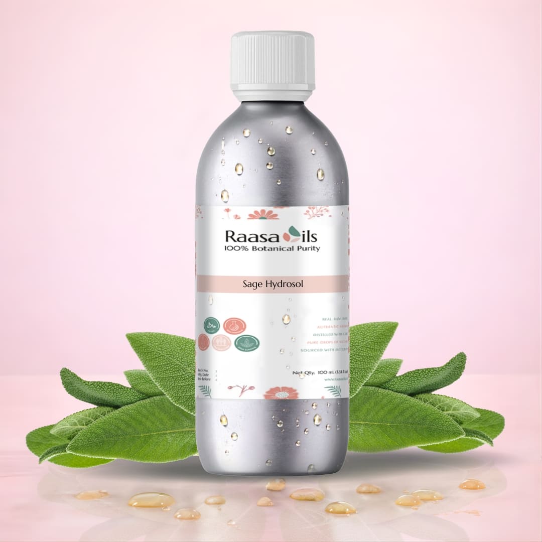 Bottle of Raasa Oils Sage Hydrosol with sage leaves on a pink background