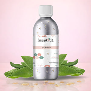 Bottle of Raasa Oils Sage Hydrosol with sage leaves on a pink background