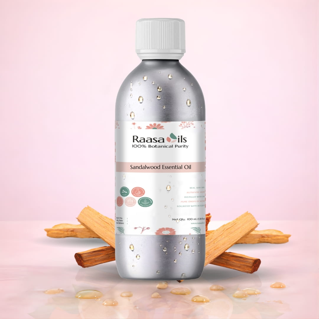 Raasa Oils Sandalwood Essential Oil bottle with Sandalwood sticks on a pink background