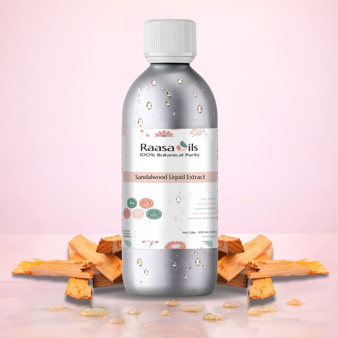 Bottle of Raasa Oils Sandalwood Liquid Extract with sandalwood pieces on a pink background