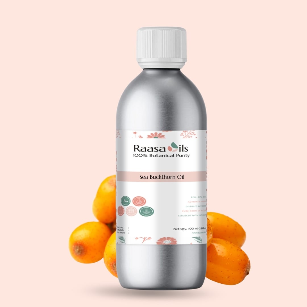 Bottle of Raasa Oils Sea Buckthorn Oil with sea buckthorn fruits on a light pink background