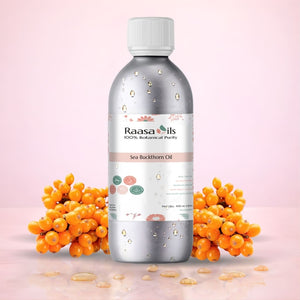 Bottle of Raasa Oils Sea Buckthorn Oil with sea buckthorn berries on a pink background