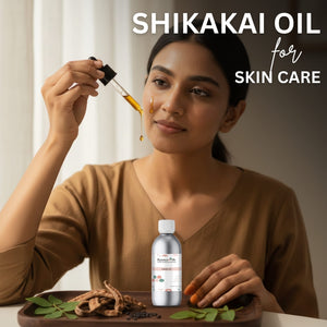 Woman holding Shikakai oil with dropper and bottle, surrounded by natural elements.
