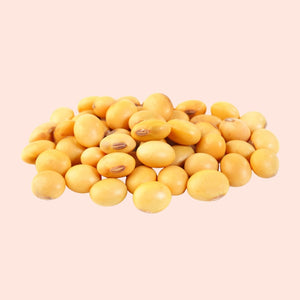 Yellow soybeans on a beige background