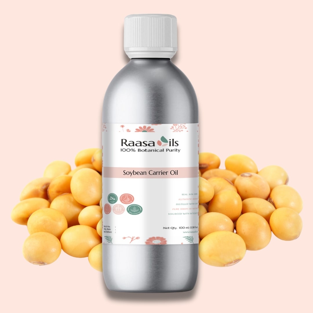 Bottle of Raasa Oils soybean carrier oil with soybeans on a pink background