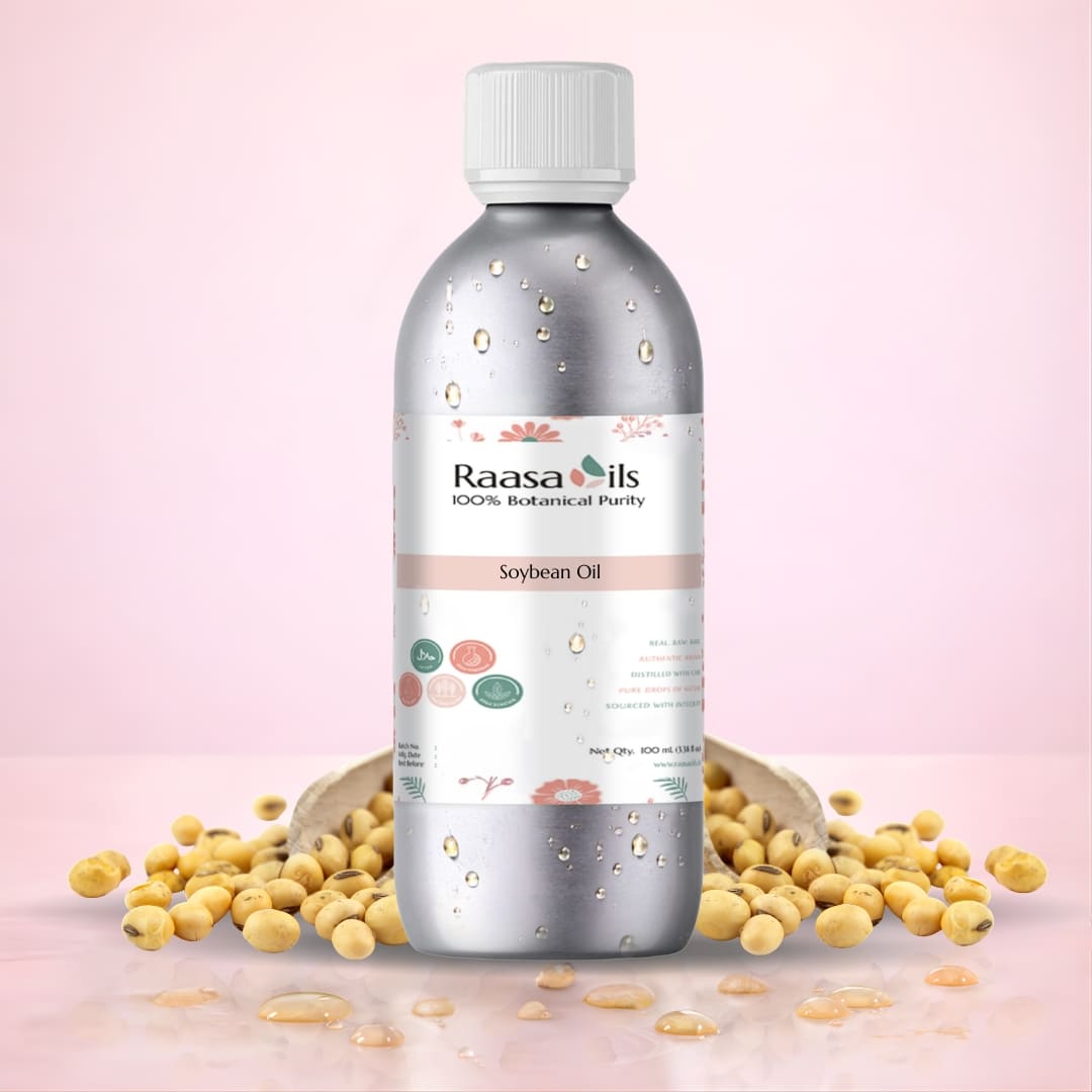 Bottle of Raasa Oils soybean oil with soybeans on a pink background