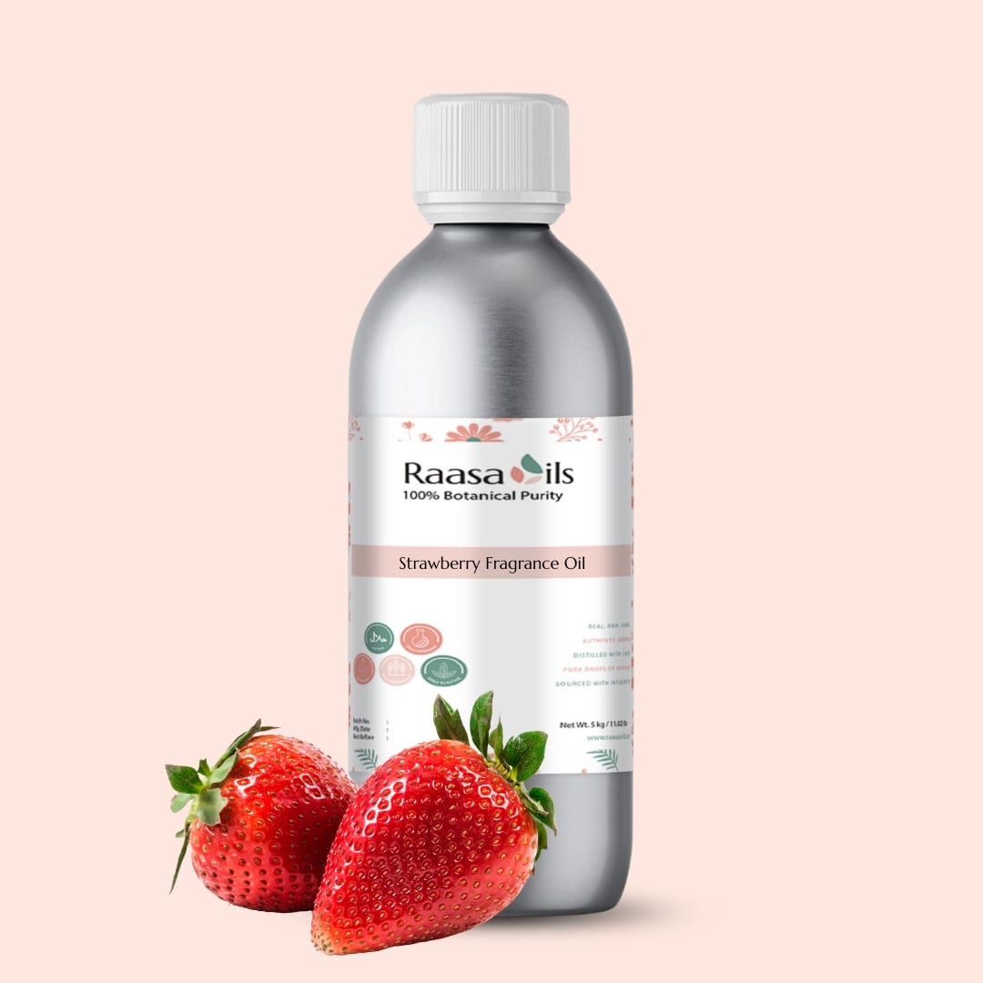 Bottle of Raasa Oils Strawberry Fragrance Oil with strawberries on a beige background