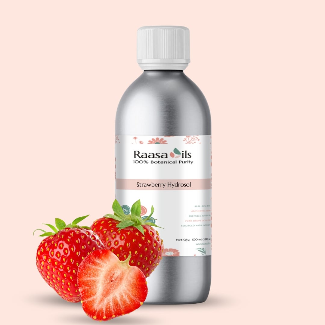 Bottle of Raasa Oils Strawberry Hydrosol with strawberries on a beige background