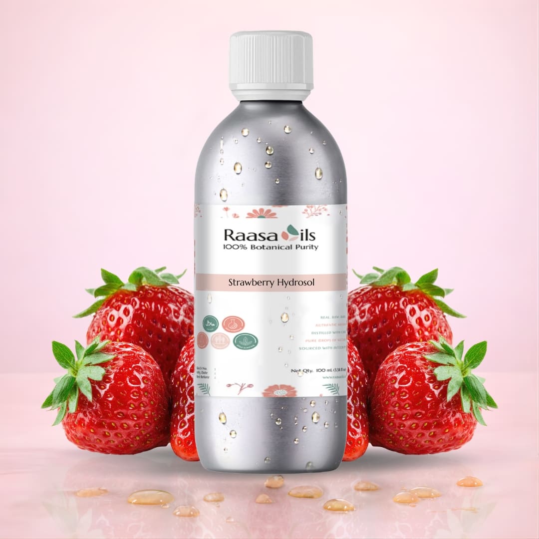 Bottle of Raasa Oils Strawberry Hydrosol with strawberries on a pink background