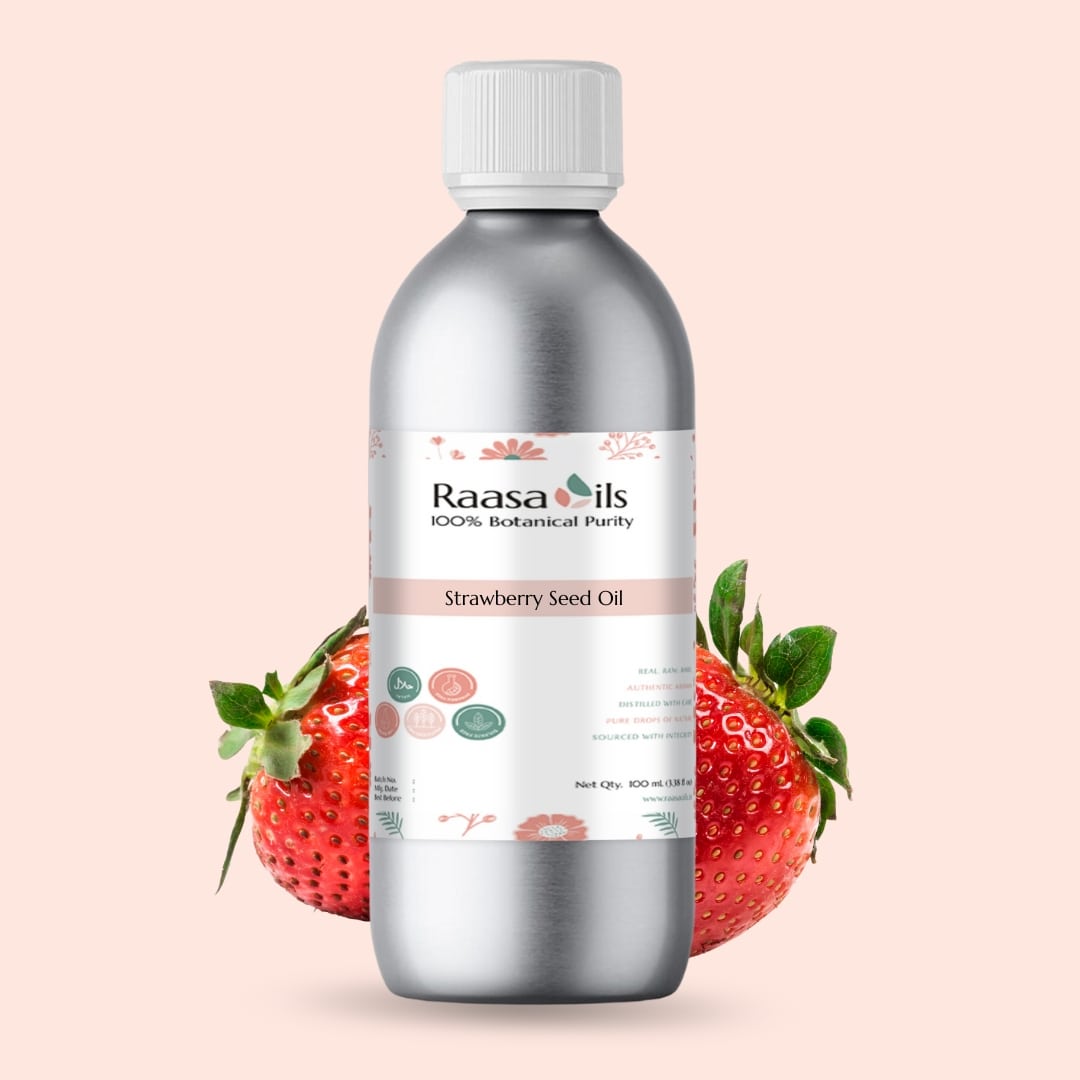 Bottle of Raasa Oils Strawberry Seed Oil with strawberries on a pink background