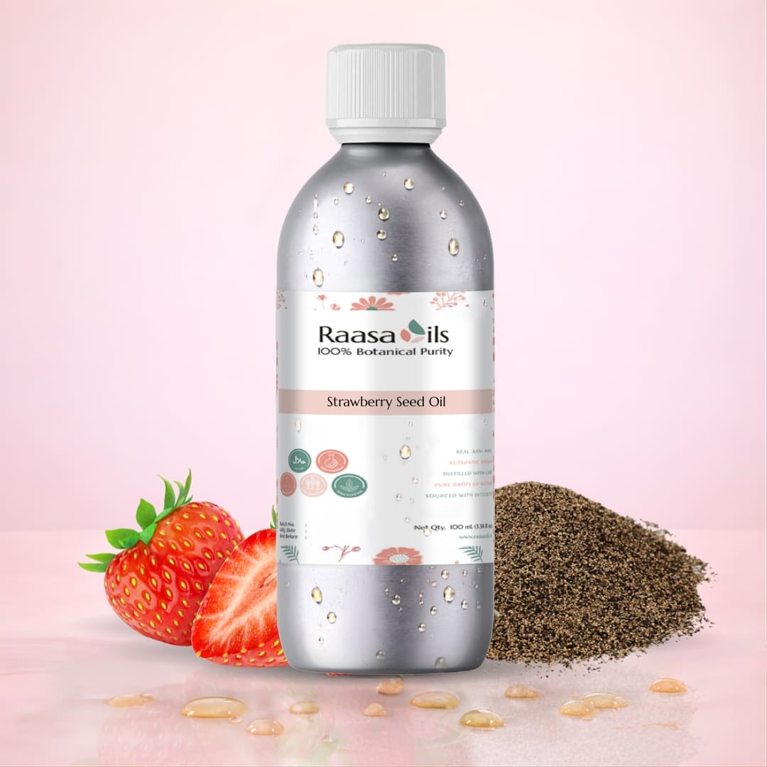 Bottle of Raasa Oils Strawberry Seed Oil with strawberries and seeds on a pink background