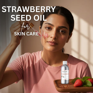 Woman applying strawberry seed oil to her face with a dropper, surrounded by strawberries and a bottle of the product.