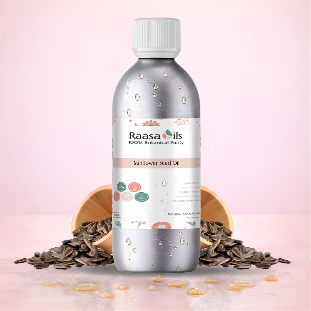Bottle of Raasa Oils Sunflower Seed Oil with sunflower seeds on a pink background