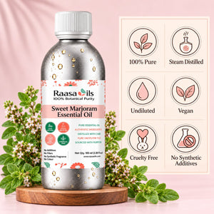 A bottle of Raasa oils Sweet Marjoram Essential Oil displayed on a wooden coaster with fresh Marjoram flowers. The background is a soft pink with a graphic detailing product benefits on the right.