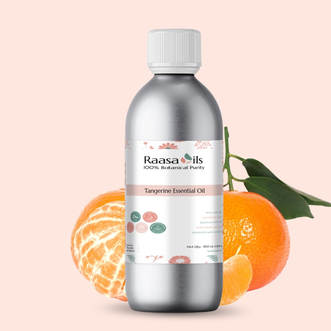 Bottle of Raasa Oils Tangerine Essential Oil with tangerines and leaves on a light pink background