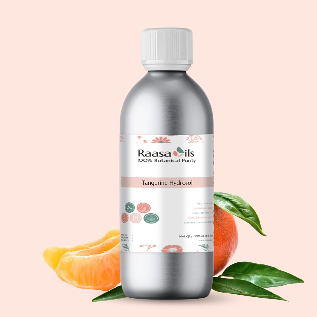 Bottle of Raasa Oils Tangerine Hydrosol with tangerine slices and leaves on a light pink background
