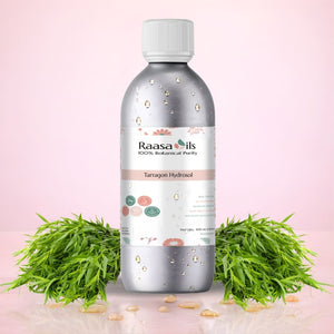 Bottle of Raasa Oils Tarragon Hydrosol with tarragon leaves on a pink background