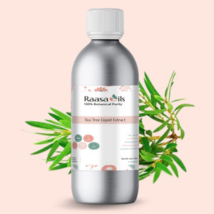 Bottle of Raasa Oils Tea Tree Liquid Extract with green leaves on a light pink background