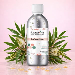 A bottle of Raasa 14ils Tea Tree Extract essential oil with botanical leaves and flowers arranged around it on a pink background.