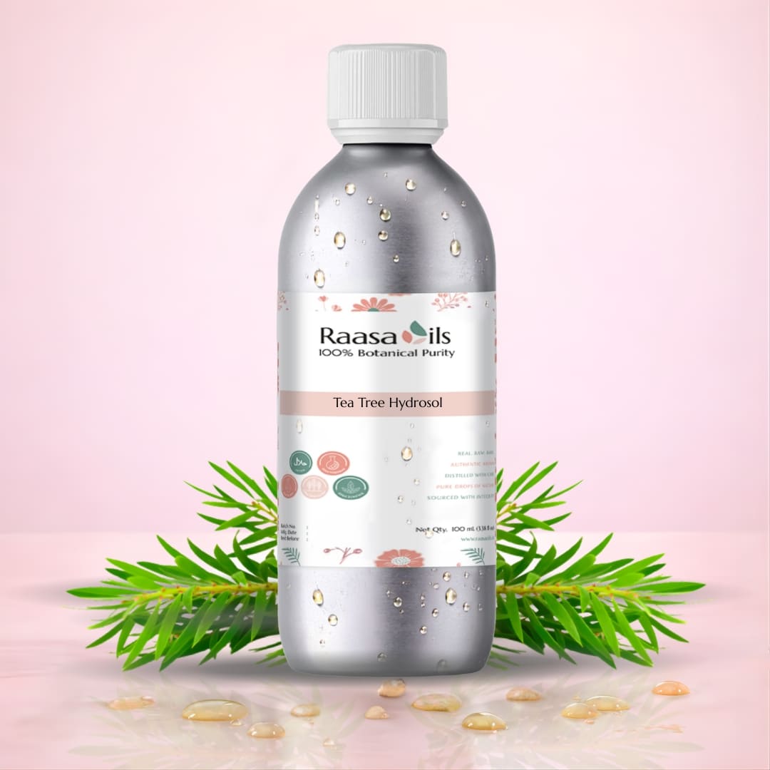 Raasa Oils Tea Tree Hydrocolloid bottle with green leaves on a pink background