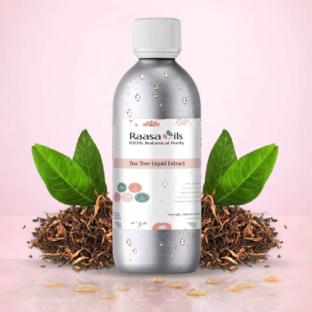 Bottle of Raasa Oils Tea Tree Liquid Extract with tea leaves and roots on a pink background