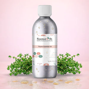 Raasa Oils Thyme Essential Oil bottle with thyme plants on a pink background