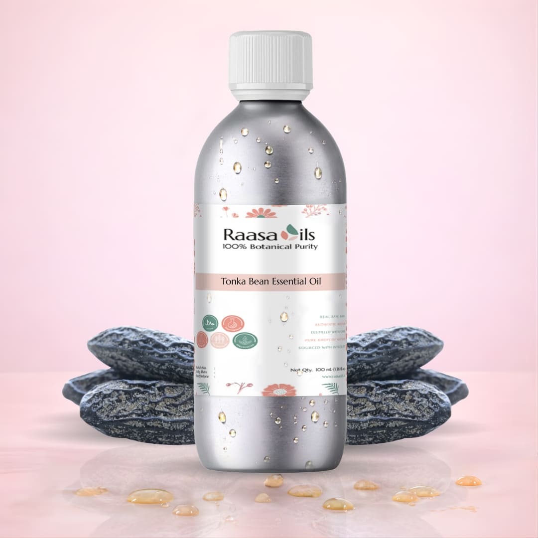 Raasa Oils Tonka Bean Essential Oil bottle with tonka beans on a pink background